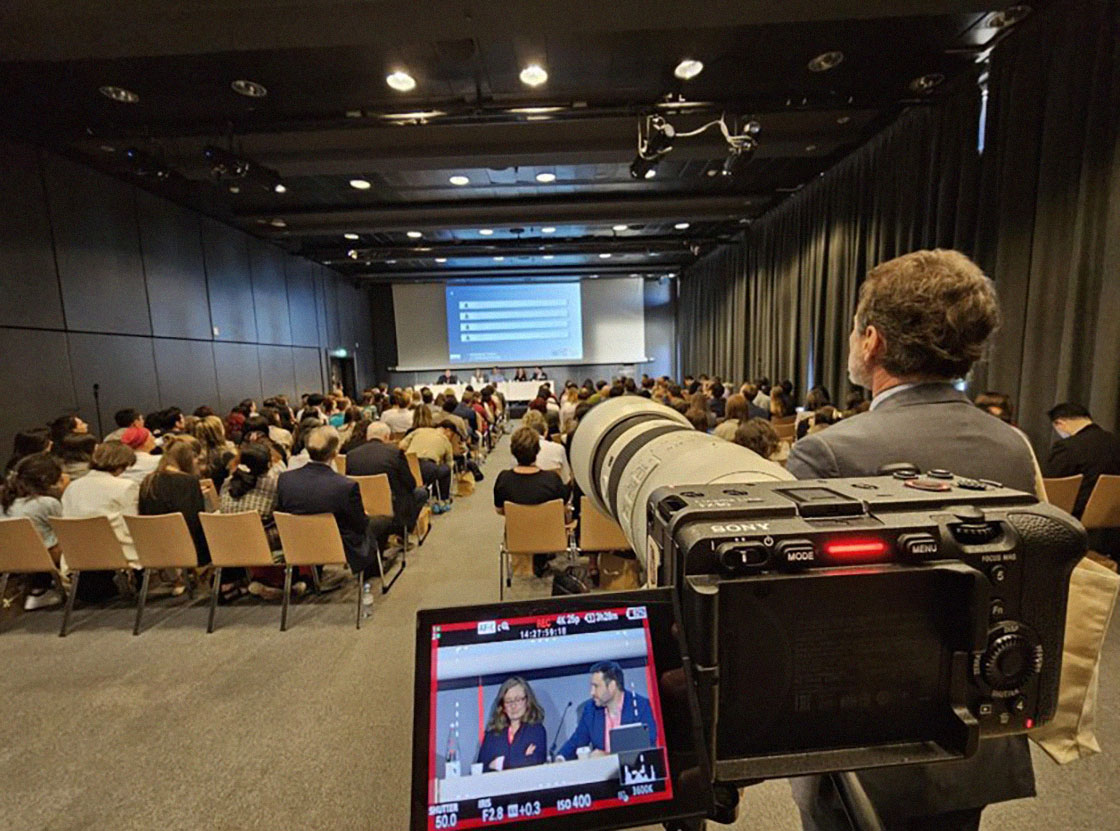 Photograph of a seminar being filmed